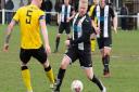 Swaffham Town's Nick Davey on a charge.