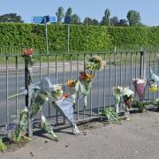 Floral tributes have been left at the scene of the crash in London Road, Thetford