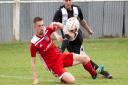 Swaffham Town striker Joe Jackson rounding the full back during his side's 2-1 win over Godmanchester Rovers in Saturday's Thurlow Nunn League Premier Division opener Picture: EDDIE DEANE