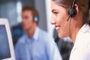 Office Worker Wearing Headset --- Image by © Royalty-Free/Corbis
