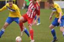 Action from when Norwich United,  yellow, took on Godmanchester earlier this year. Picture: DENISE BRADLEY