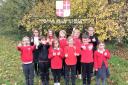 Pupils at Edmund de Moundeford school in Feltwell celebrate their third 'good' rating in a row from Ofsted