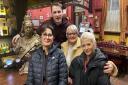 Kylie and her mum Barbara with Danielle Harold and Max Bowden who plays Ben Mitchell inside the Queen Vic on the Eastenders set
