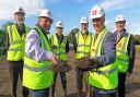 Andrew Savage of Broadland Housing association (holding spade, left) and Philip Cowen of Breckland Council (holding spade, right), with  (back row, from left) David Childerhouse, Ben Campbell and Tom Bennet of Great Hockham Parish Council, and Michael