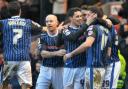Ian Henderson celebrates a goal with his Rochdale team-mates. Picture: Manchester Evening News.