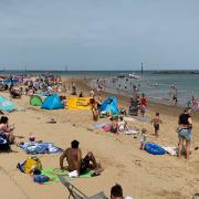 People enjoying the weather on Sea Palling Beach