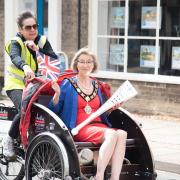 The torch reaches Mildenhall with Rachel Thomas, trustee for the rickshaw and Mildenhall Mayor Jane Busuttil