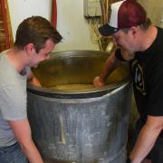 Norwich Amateur Brewers Jack Davison and Will Gant brewing a new beer which they will be selling to raise money for the NHS.