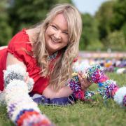 Brandon Yarn Bombers have created over thirty one thousand pom poms in an attempt to break the world record for the longest line of pom-poms. One of the organisers, Claire Watts.