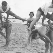 Leapfrogging on the beach in Lowestoft in the 1950s. Photo: Archant