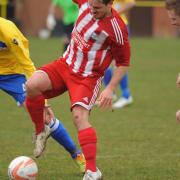 Action from when Norwich United,  yellow, took on Godmanchester earlier this year. Picture: DENISE BRADLEY
