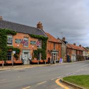 Burnham Market is one of Norfolk's second homes hotspots. Inset: County Hall and county councillor Jane James